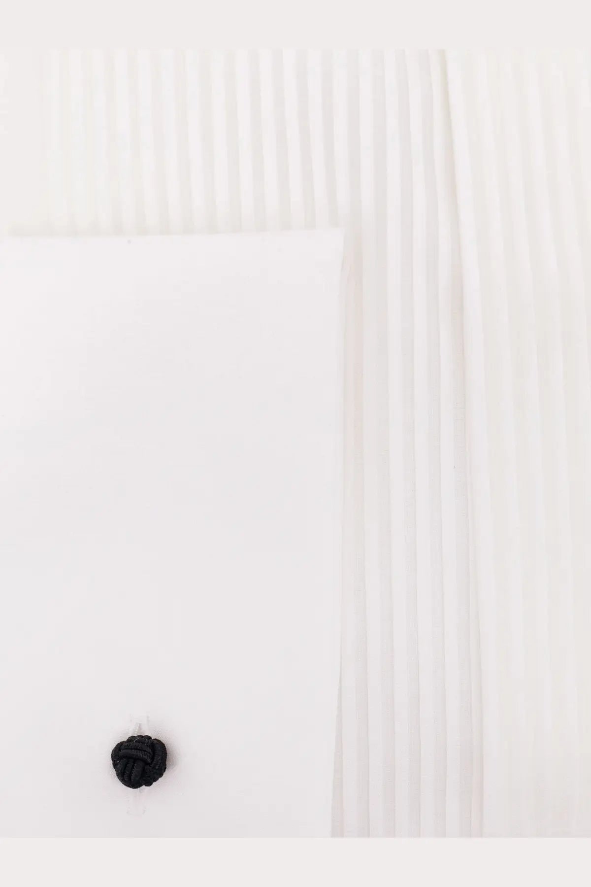 Black knotted fabric button on Giorgio Armani men’s white cotton shirt front detail