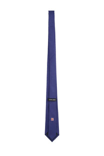 A sleek solid royal blue silk tie from Giorgio Armani designed for men
