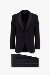 Black tuxedo jacket with satin lapels and matching virgin wool trousers by Giorgio Armani men’s Soho collection