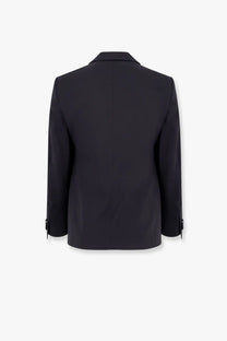 Black tailored blazer with sleek structured silhouette and subtle button cuffs from Giorgio Armani Soho virgin wool tuxedo blue