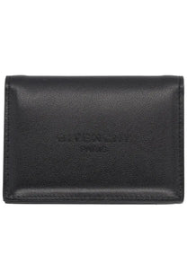Black Givenchy Paris leather card case with embossed branding from Givenchy men’s card holder Antigona collection