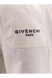 Givenchy men’s cotton Bermuda shorts white paired with a cream-colored herringbone jacket with black chest embroidery