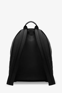 Givenchy men’s essential black nylon backpack with padded shoulder straps and top handle shown from the back side
