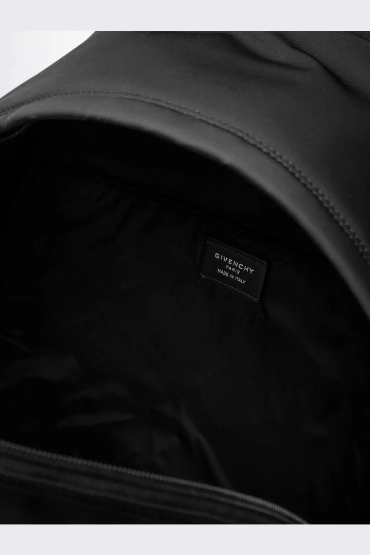 Black givenchy mens essential nylon backpack interior showing made in italy label and spacious compartments