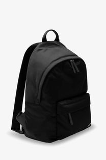 Givenchy men’s essential black nylon backpack with sleek minimalist design and subtle branding on lower right corner