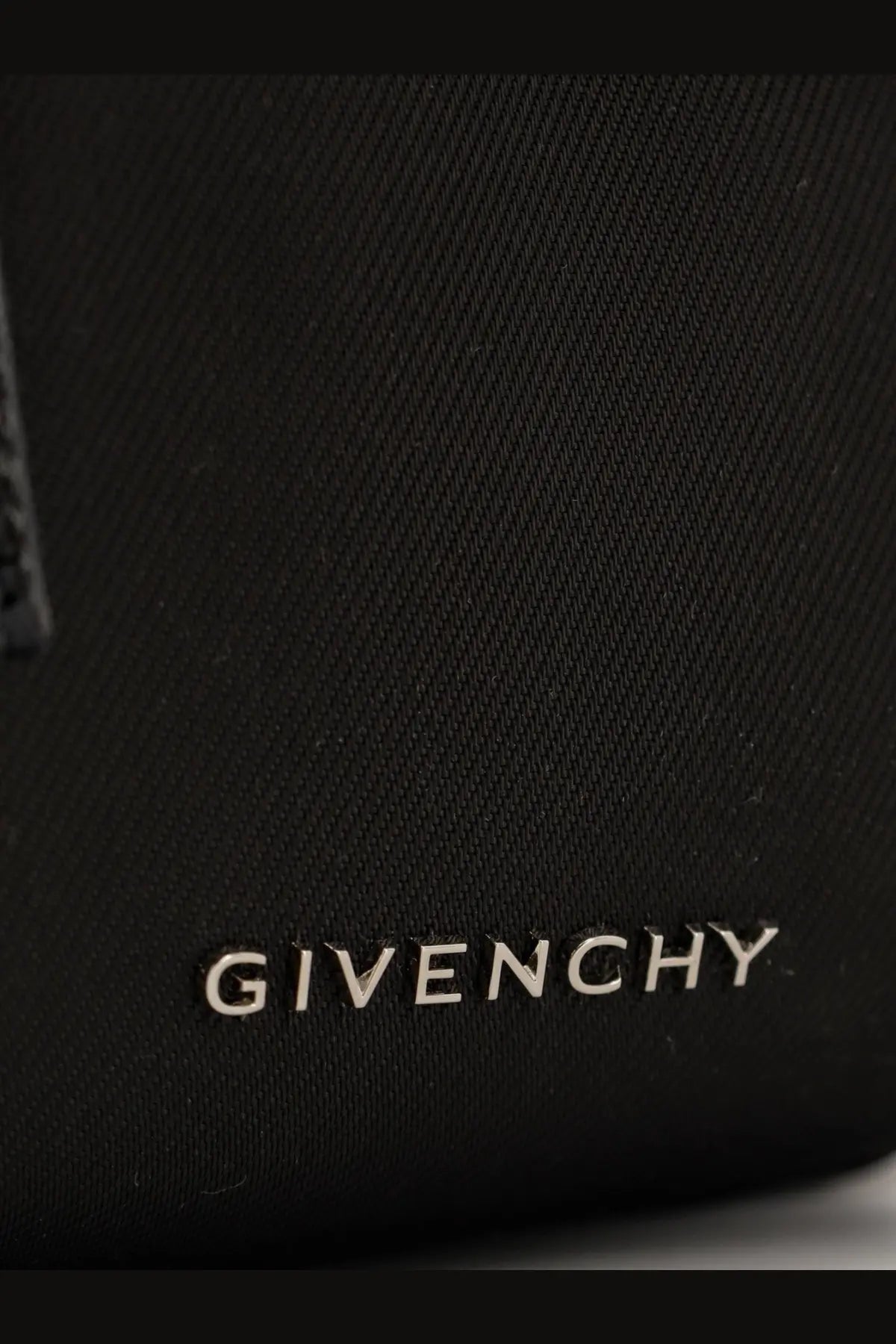 Givenchy men’s essential nylon belt bag black with textured fabric surface and silver logo embossed at the bottom