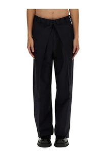 Givenchy men’s extra large black wide-leg trousers with structured minimalist design and subtle front pleats