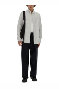 Light gray button-down shirt with classic collar and long sleeves paired with givenchy men extra large blue pants