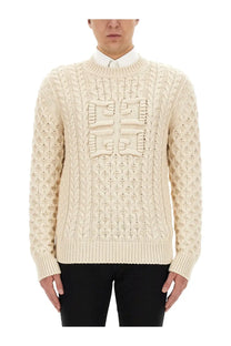 Givenchy men’s cream-colored cable-knit sweater with textured raised logo on chest in soft jersey fabric