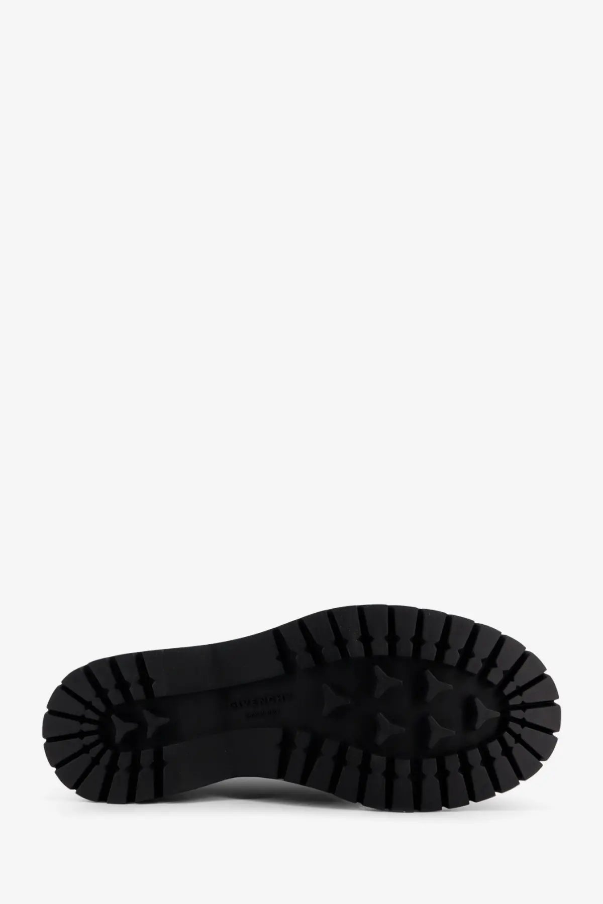 Black rubber sole with deep textured tread on givenchy mens black leather ankle boots back side view