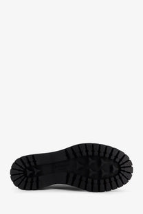 Black rubber sole with deep textured tread on givenchy mens black leather ankle boots back side view