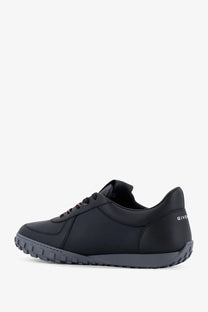 Black givenchy men’s leather sneaker with sleek minimalist design and subtle branding on the heel shown from back