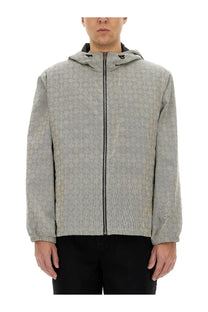 Givenchy men’s grey hooded anorak jacquard jacket with repeating monogram pattern and black zipper closure
