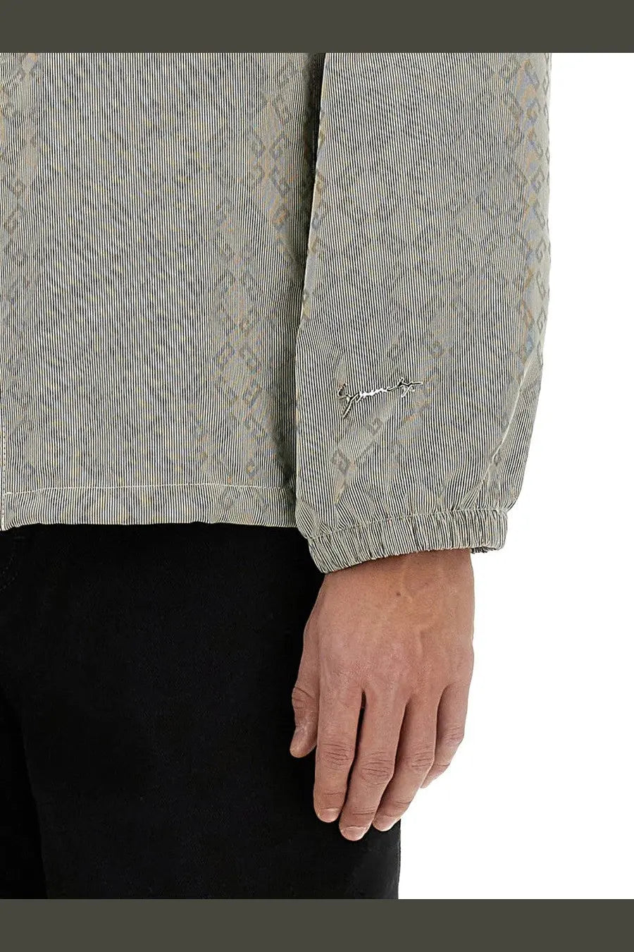 Givenchy men’s light gray corduroy jacket with subtle geometric pattern and embroidered logo on sleeve