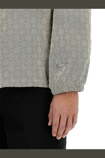 Givenchy men’s light gray corduroy jacket with subtle geometric pattern and embroidered logo on sleeve