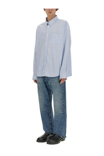 Light blue and white striped long-sleeved button-up shirt with classic collar paired with givenchy mens blue jeans
