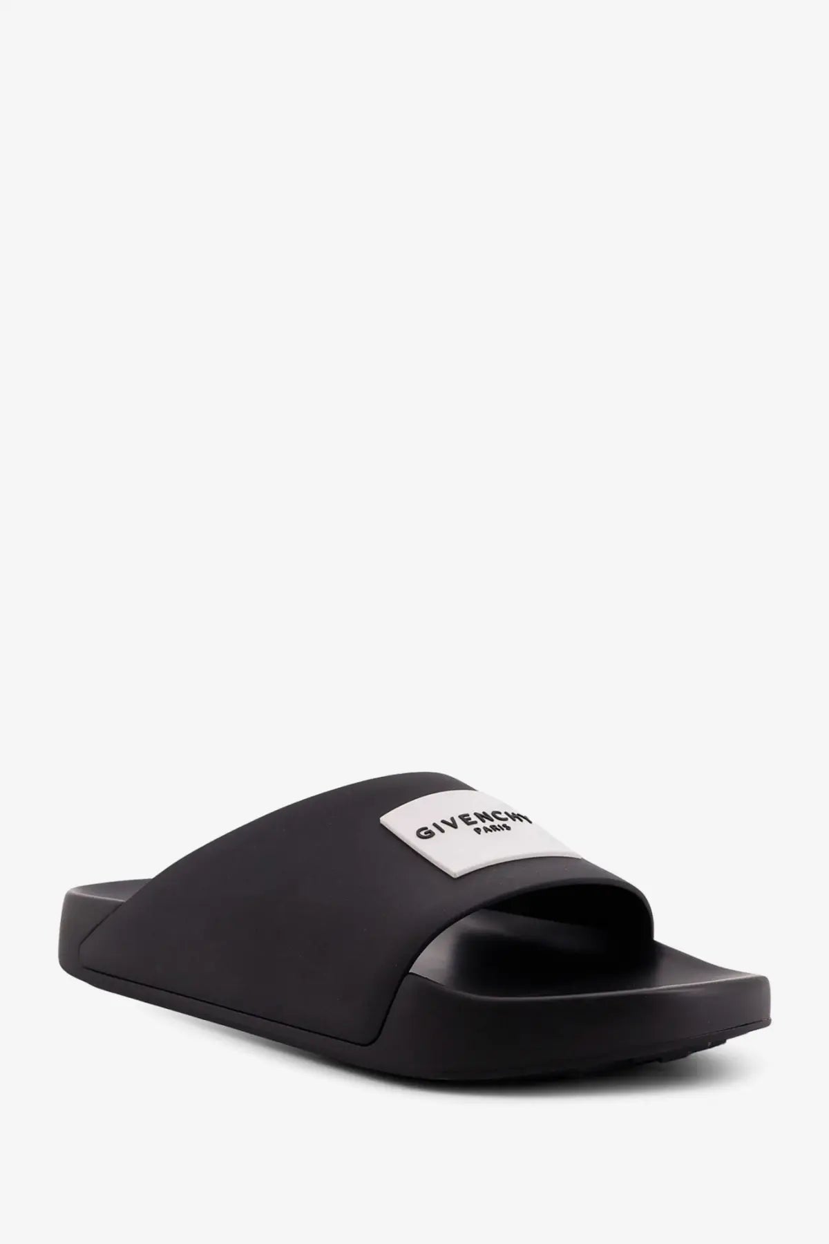 Givenchy men’s rubber slide sandal in black with minimalist design and white logo patch on the strap