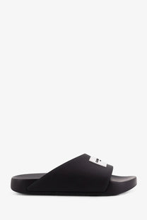 Givenchy men’s black rubber slide sandal with minimalist design and small white label on the strap