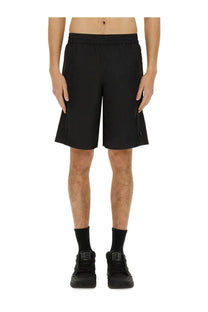 Givenchy men’s short track casual black athletic shorts with sleek modern design and subtle side pockets