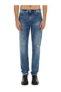 Givenchy men’s slim fit denim jeans in blue with faded wash and subtle distressing at the knees