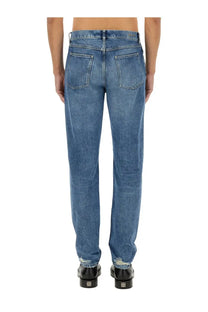 Givenchy men’s slim fit denim jeans in blue with straight-leg cut and distressed cuffs made of denim material