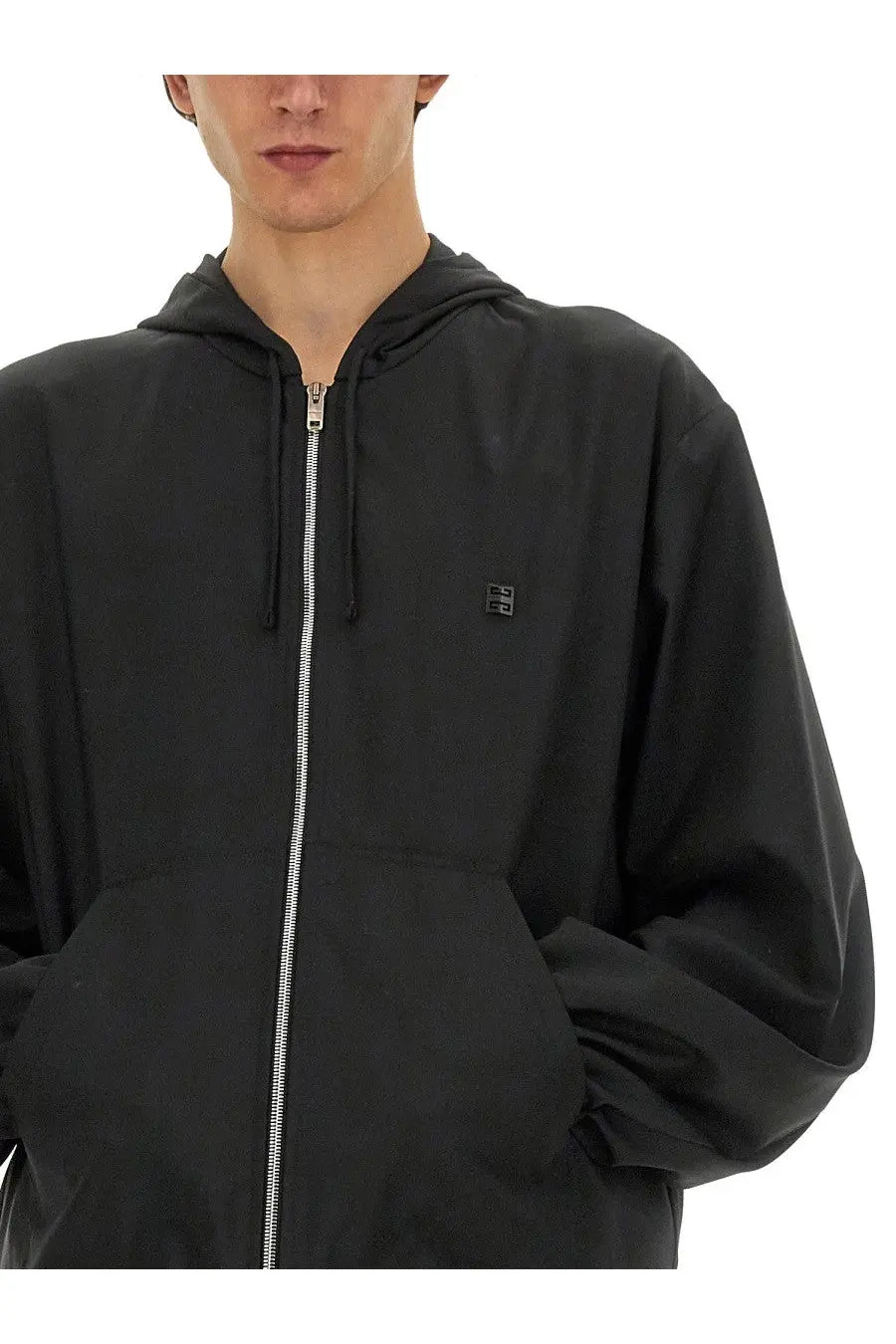 Givenchy men’s black hooded zip sweatshirt with silver zipper and small logo patch on chest