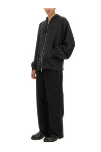 Givenchy men’s black zip sweatshirt with hood made from soft material featuring a subtle chest logo