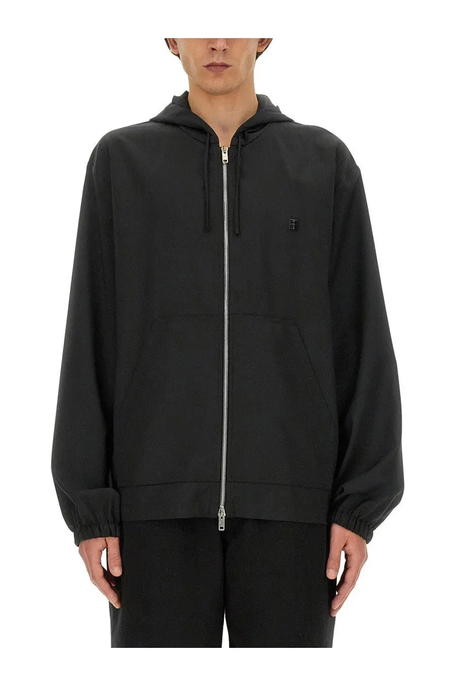 Givenchy men’s black zip sweatshirt with a subtle embroidered logo and elastic cuffs in a zip-up hoodie style