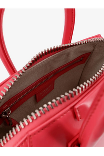 Vibrant red patent leather Givenchy Antigona Mini crossbody bag with silver-toned zipper and structured handles