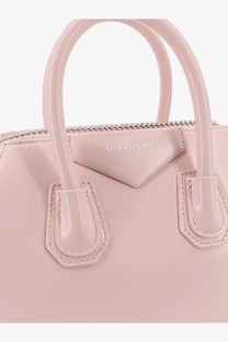 Givenchy women’s antigona mini leather shoulder bag in pale pink with glossy leather handles and signature triangular flap