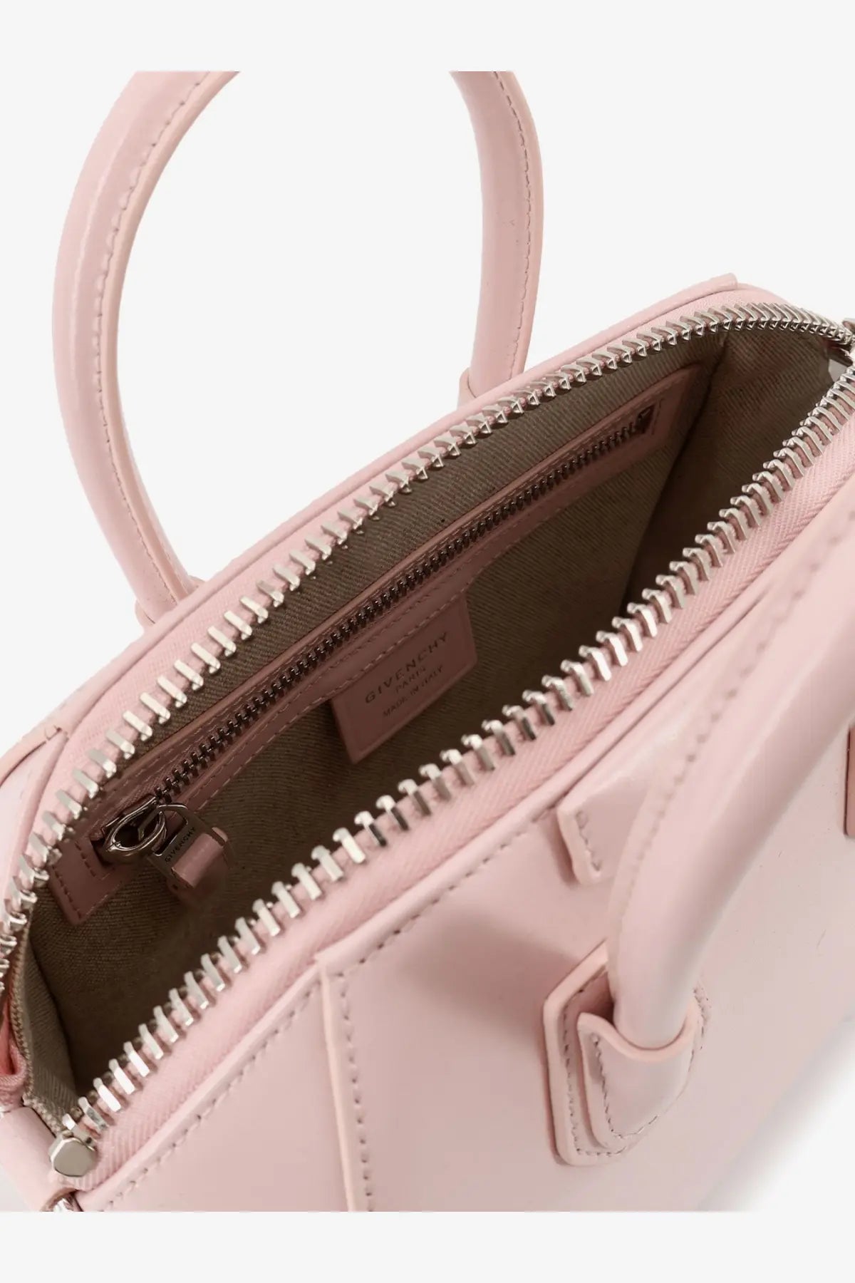 Givenchy women’s antigona mini leather shoulder bag in soft pink with sleek design and metallic zipper accents