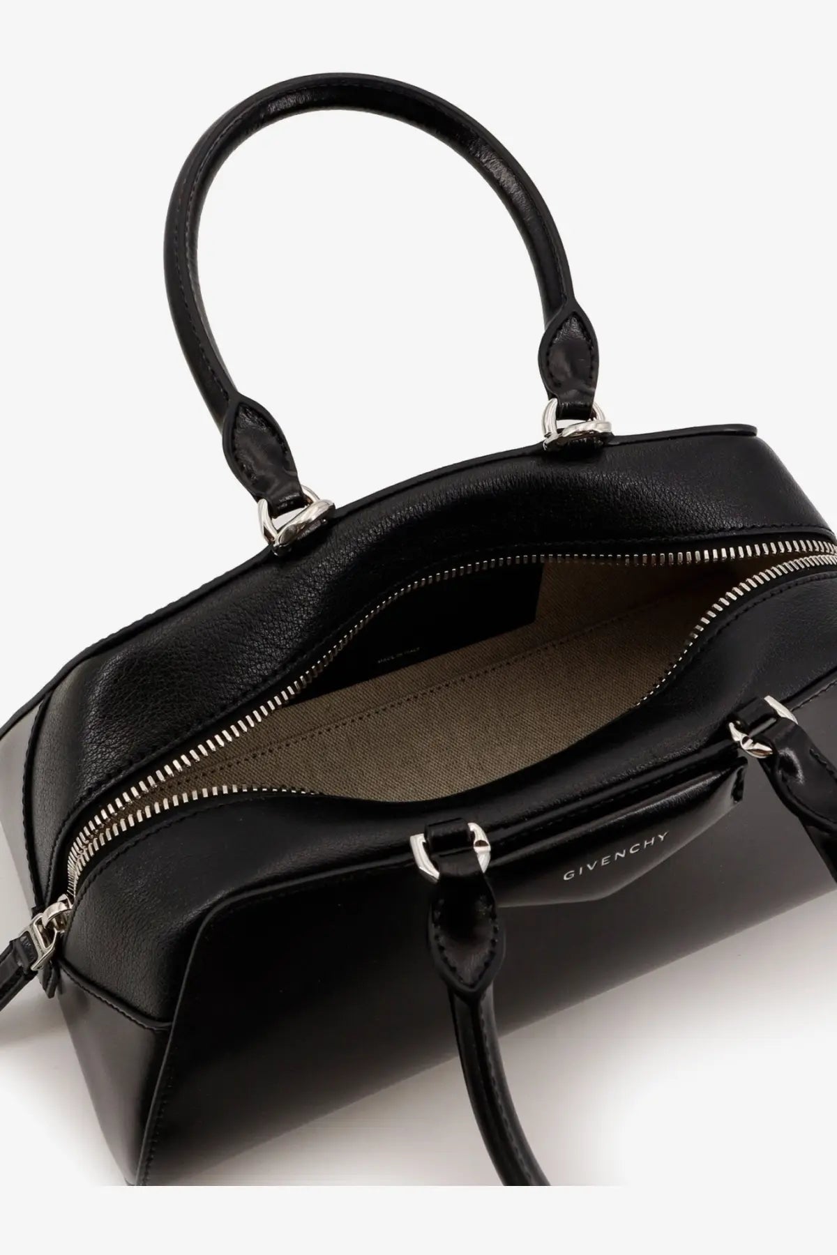 Black Givenchy Women’s Antigona small leather crossbody bag with sleek leather exterior and silver-toned hardware