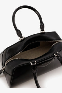 Black Givenchy Women’s Antigona small leather crossbody bag with sleek leather exterior and silver-toned hardware