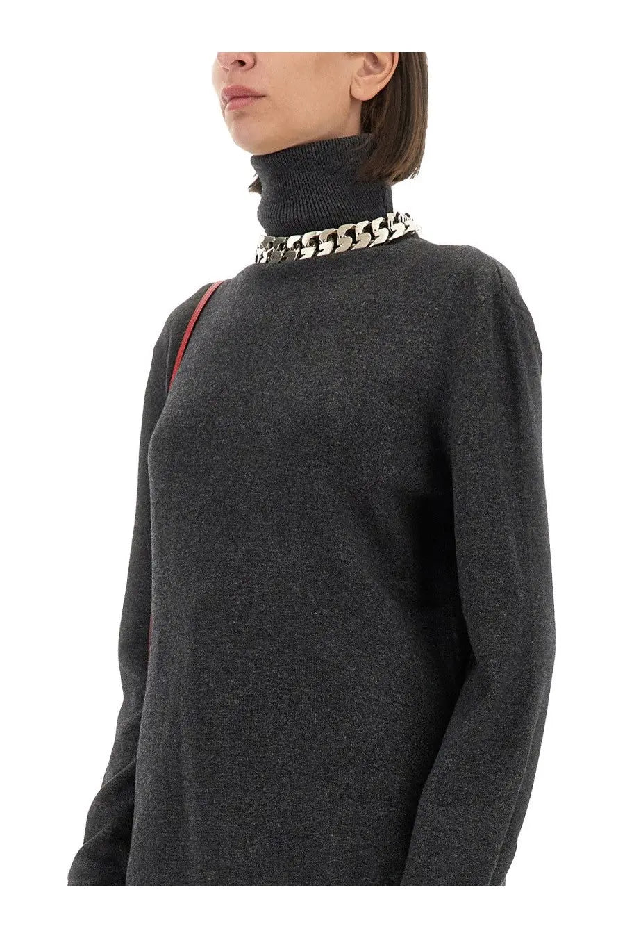 Givenchy women’s dark gray cashmere turtleneck sweater with a bold silver chain necklace around the neck