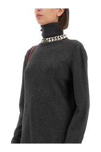 Givenchy women’s dark gray cashmere turtleneck sweater with a bold silver chain necklace around the neck