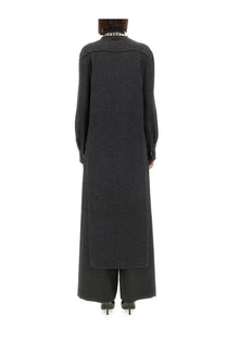 Givenchy women’s grey cashmere pullover with a long dark gray textured coat and chain necklace at the collar