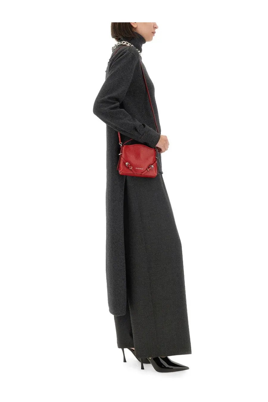 A vibrant red leather crossbody bag with gold-tone hardware and a structured compact design shown with Givenchy grey cashmere pullover