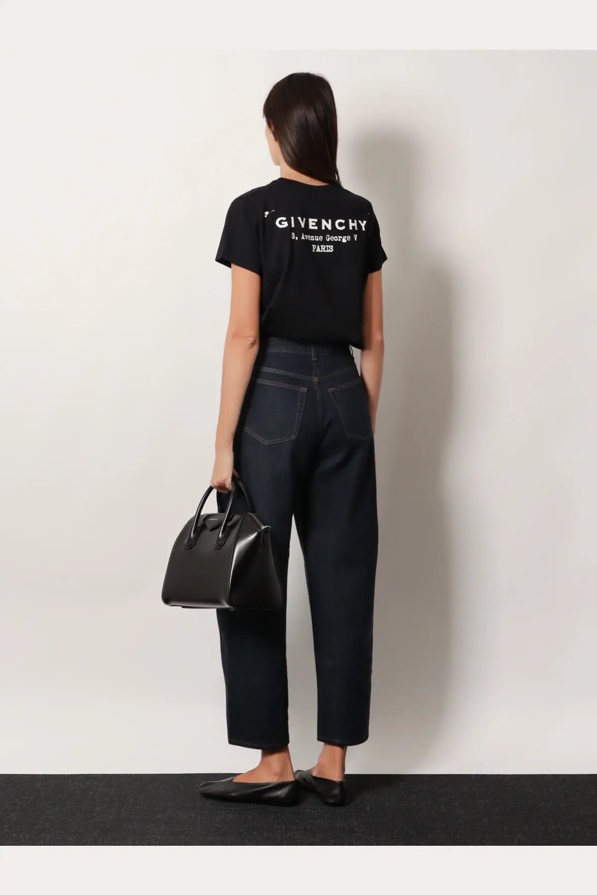 Black givenchy tote bag with structured design and top handles complementing givenchy women’s cotton shirt black