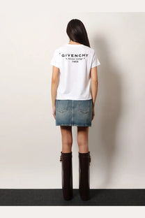 Back side of givenchy women’s white cotton t-shirt with black printed text reading givenchy 3 avenue george v paris