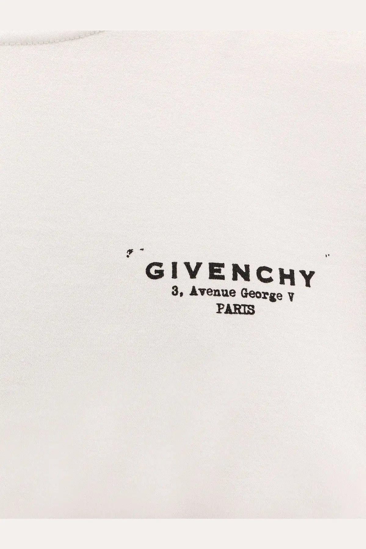 White Givenchy women’s cotton t-shirt featuring black printed text with brand name and address on the front