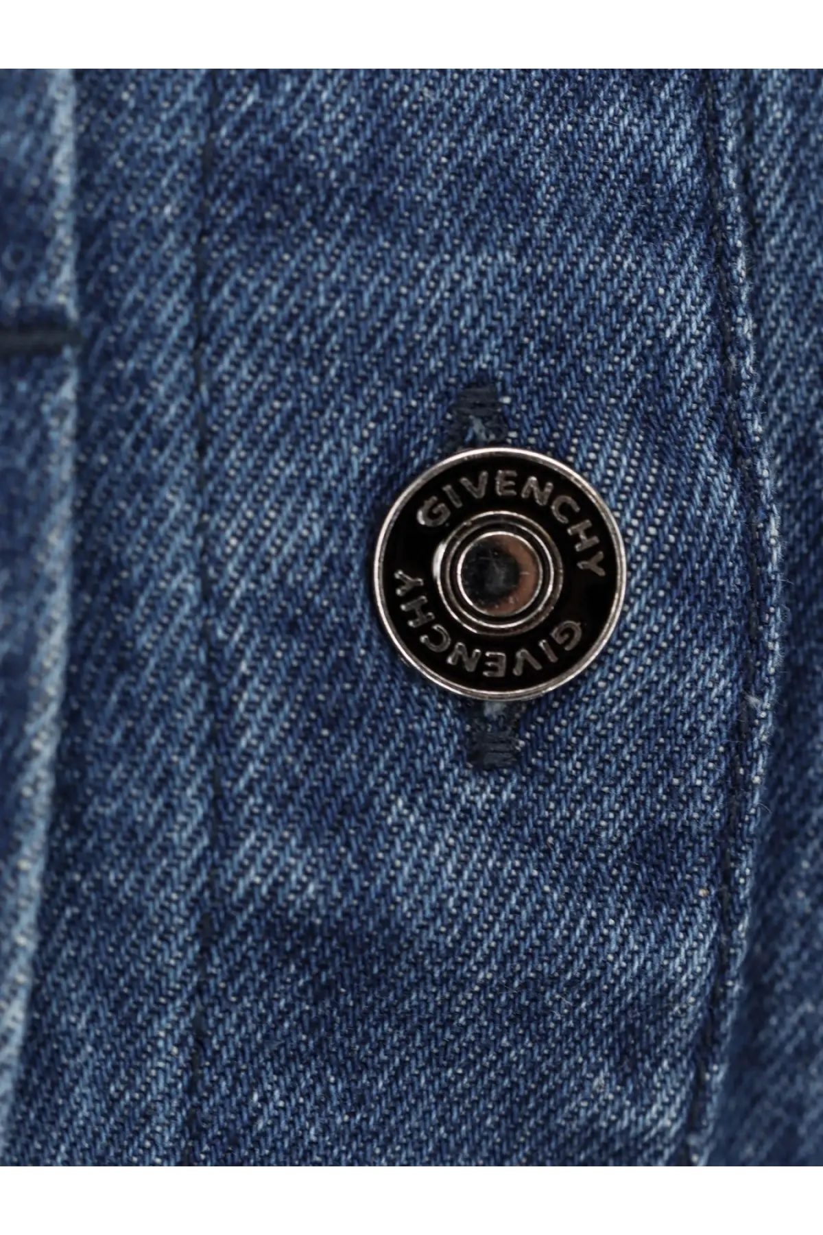 Silver givenchy button detail on blue denim fabric of women’s denim chemisier dress