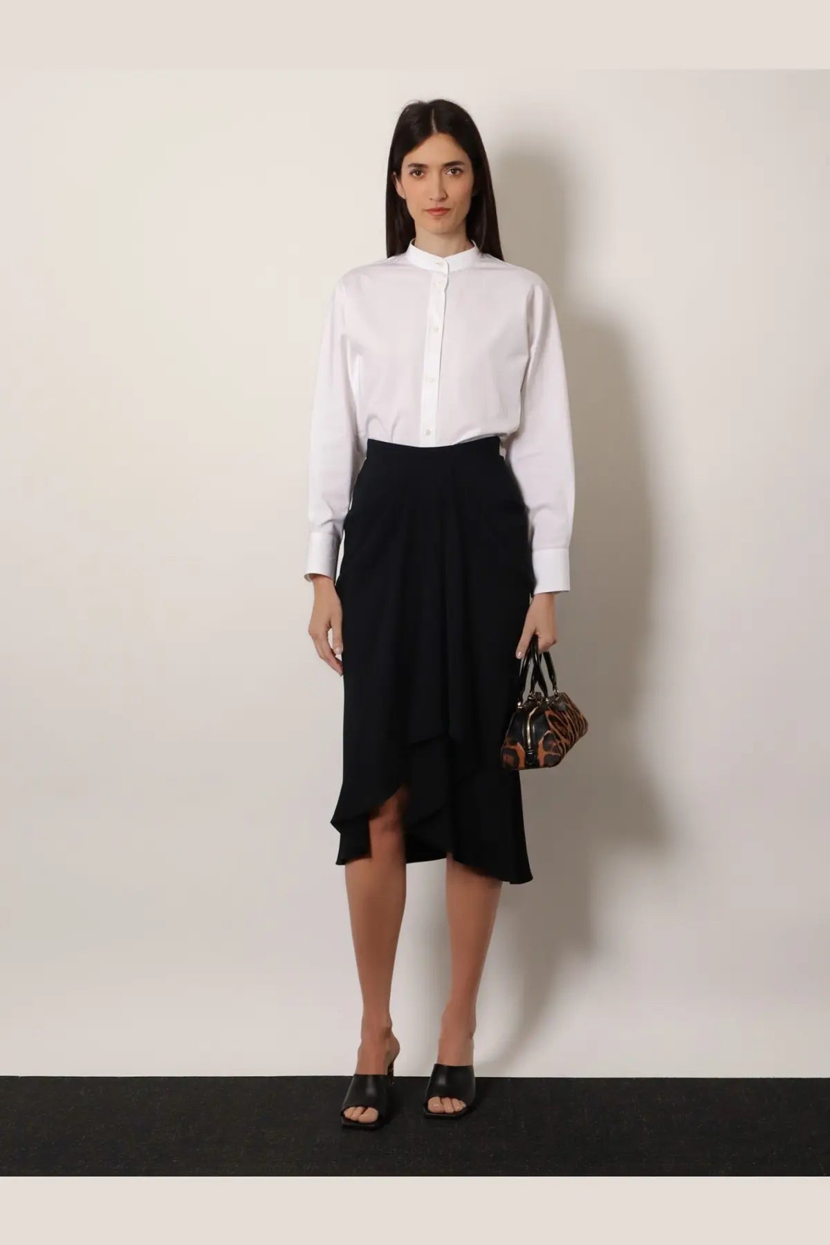 Givenchy women’s black draped midi skirt featuring asymmetrical ruffled design ideal for elegant occasions