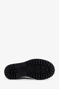Black rubber sole with deep textured tread and embossed brand logo on givenchy women’s leather ankle boots black