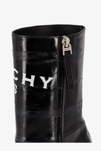 Black patent leather ankle boot with white Givenchy lettering and silver zipper pull for women