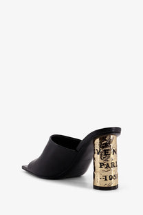 Givenchy women’s black leather mule sandal with gold toned textured heel embossed veneti paris 1950 lettering back side