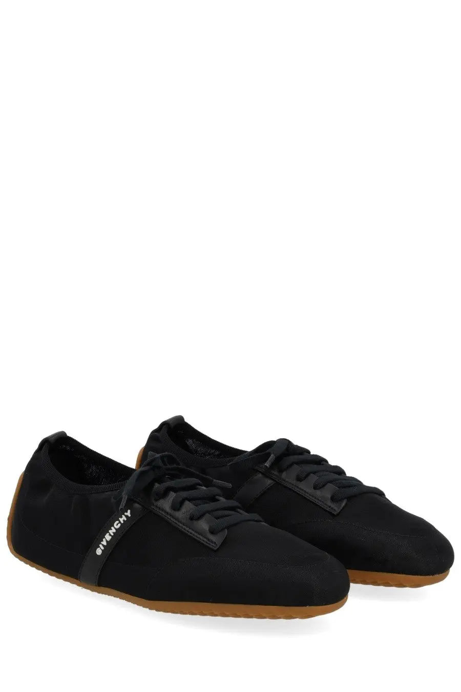 Givenchy women’s minimal slim sneaker black featuring suede upper and contrasting tan rubber soles