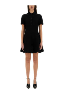 Givenchy women’s black short-sleeved polo dress with flared skirt and subtle lace detailing along the hem
