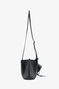 Givenchy women’s black leather nano snap bucket bag with long adjustable strap and decorative tassel crossbody bag