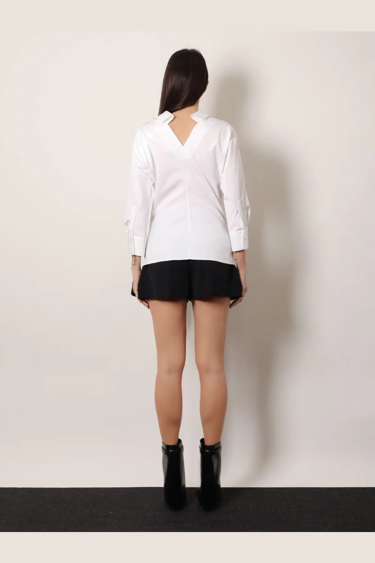 Givenchy women’s white cotton long-sleeved blouse with v-neckline and structured shoulders for stylish wear
