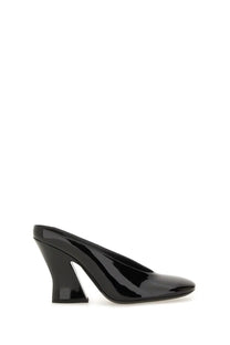 Givenchy women’s black patent leather mule shoe with a sleek angular sculpted heel shown from the back side
